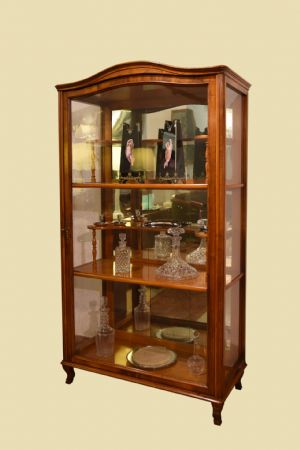 Showcase in walnut with molding
    